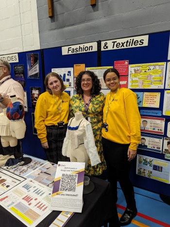 Miss Martin with two fashion and textiles students